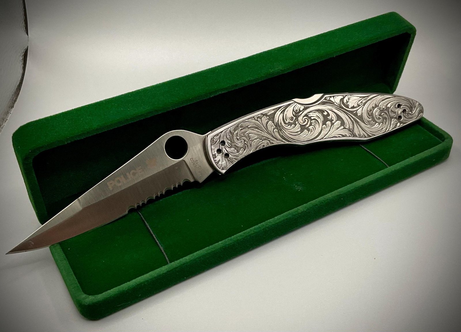 Hand Engraved Spyderco Police Knife – Deep Scrollwork, “May the Angel Ride With You” custom engraved custom knife accessory shown in product photos by The Steel Canvas SKU KN-04