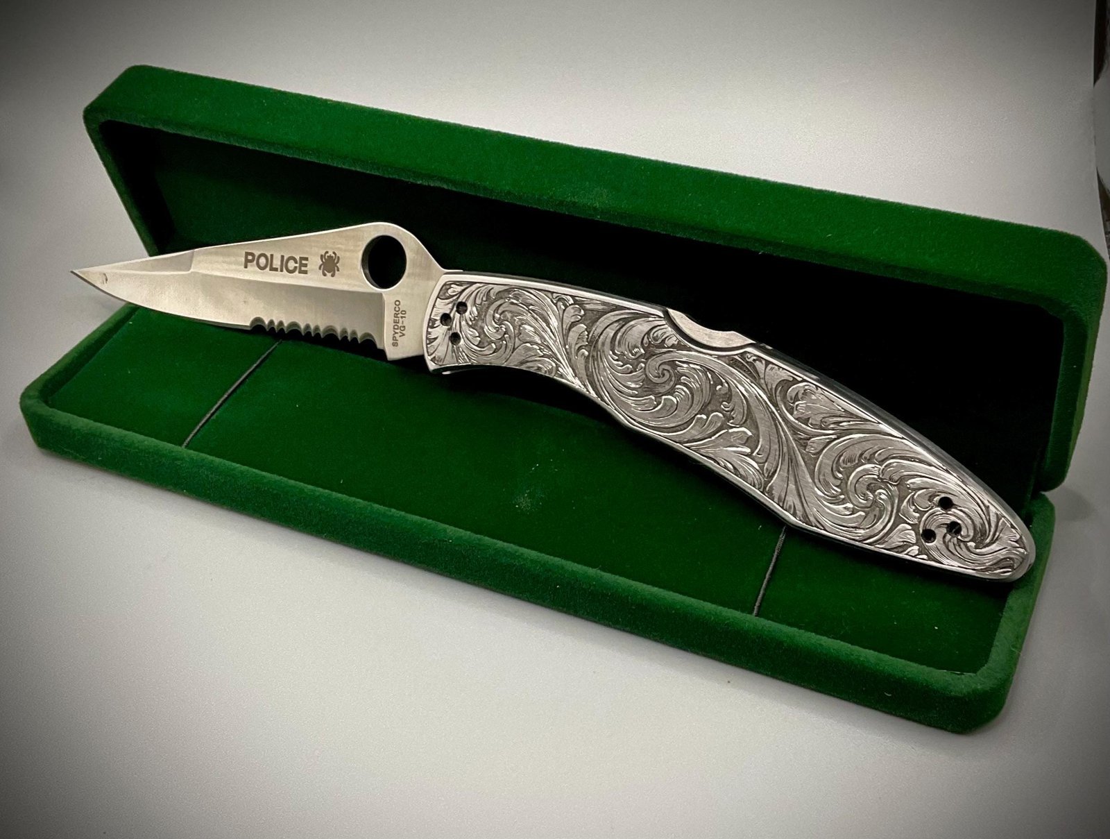 Hand Engraved Spyderco Police Knife – Deep Scrollwork, “May the Angel Ride With You” custom engraved custom knife accessory shown in product photos by The Steel Canvas SKU KN-04