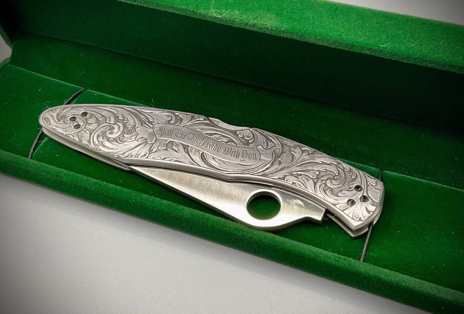 Hand Engraved Spyderco Police Knife – Deep Scrollwork, “May the Angel Ride With You” custom engraved custom knife accessory shown in product photos by The Steel Canvas SKU KN-04
