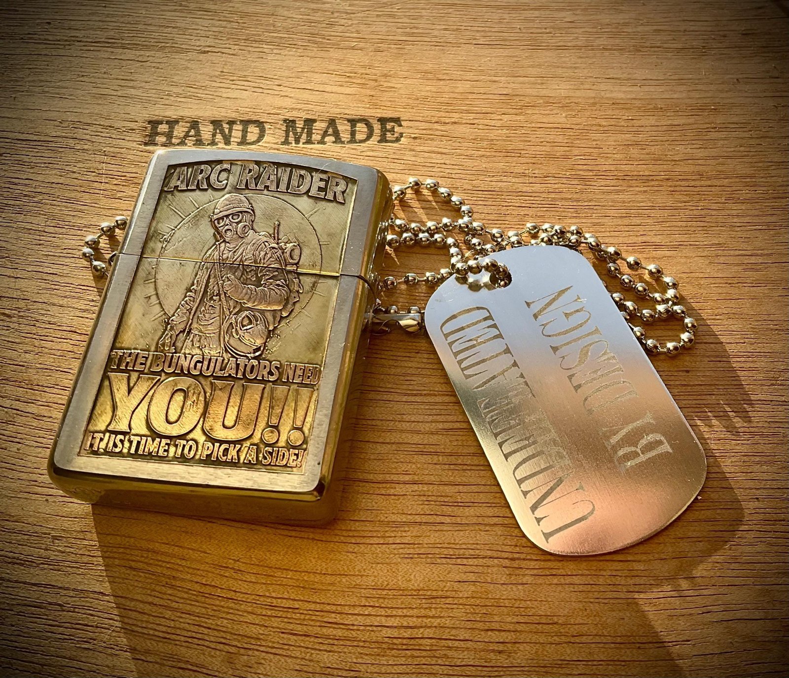 One-of-a-Kind ARC Raiders Zippo – Deep Engraved Brass Armor Case – Signed & Serialized Collector Piece custom engraved custom lighter shown in product photos by The Steel Canvas SKU ZIP-ARK-01