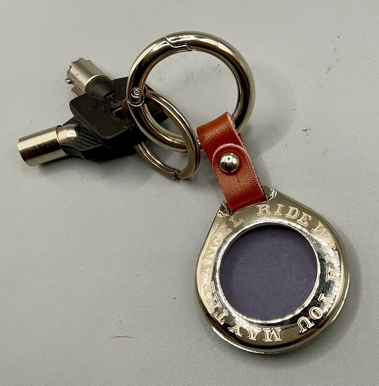 Harley “Old Skool” Sculpted AirTag Holder – Handmade Metal Keychain for Riders (AirTag Not Included) custom engraved motorcycle accessory shown in product photos by The Steel Canvas SKU HD-KEY-01
